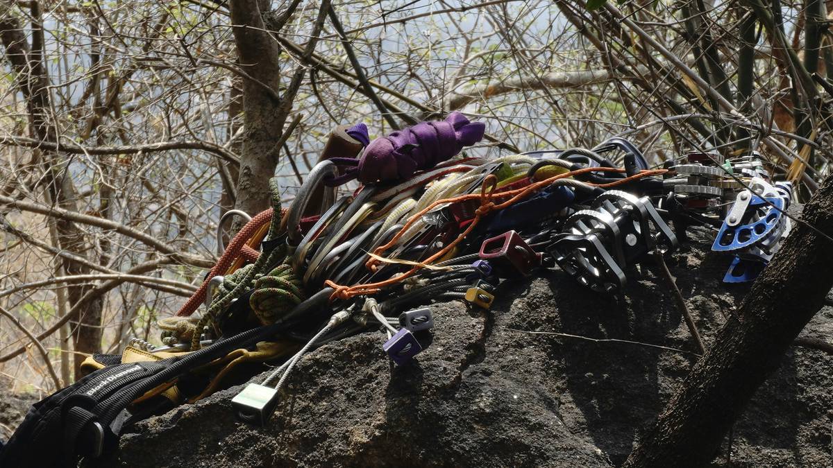 Climber using a route guard on a limestone face showing route guard benefits